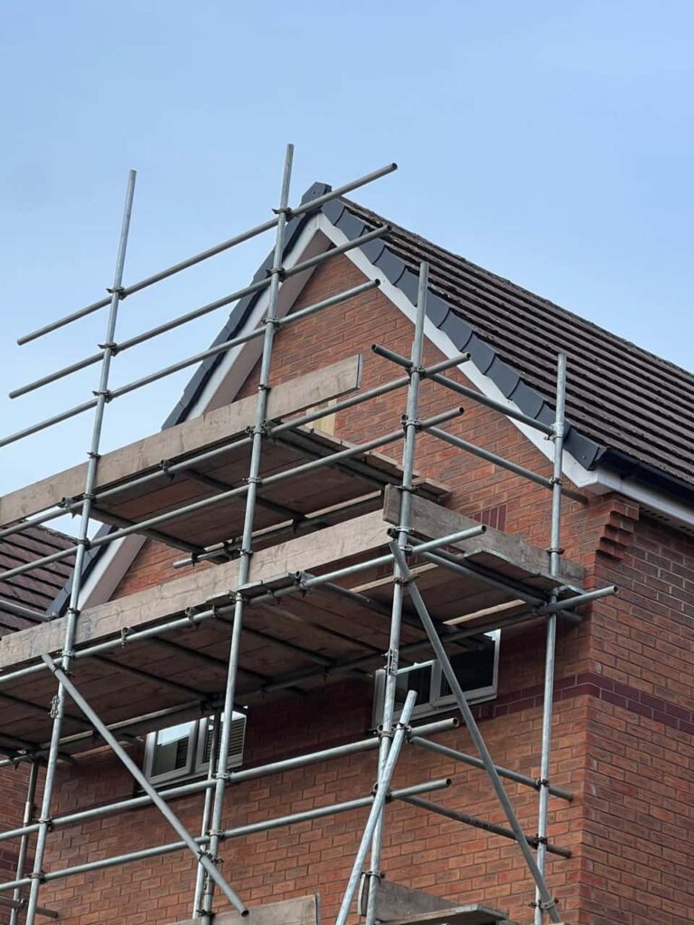 This is a photo of a roof which has just been repaired. There is a scaffold located at the gable end for access onto the roof. Works carried out by Saxilby Roofing Repairs